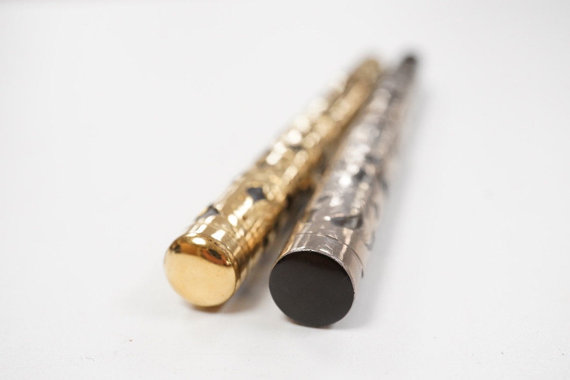 A Swan MT & Co. sterling silver filigree eyedropper along with similar gold filled example